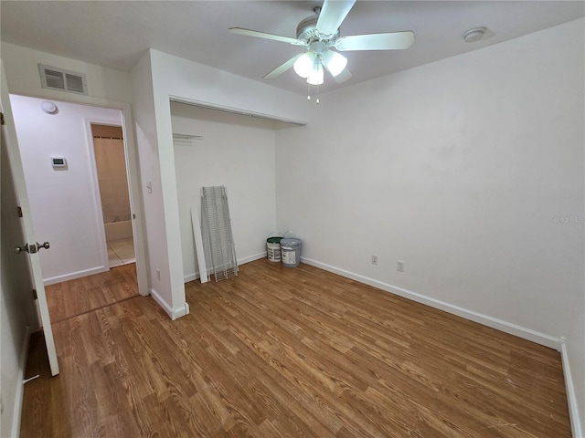 interior space with hardwood / wood-style floors and ceiling fan