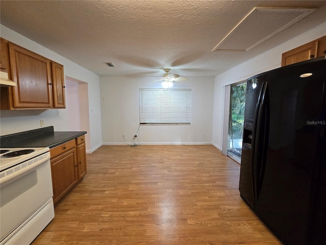 kitchen with black refrigerator with ice dispenser, a textured ceiling, ceiling fan, electric range, and light hardwood / wood-style floors