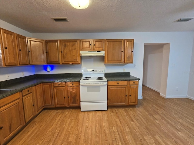 kitchen featuring light hardwood / wood-style floors, white electric range, and a textured ceiling