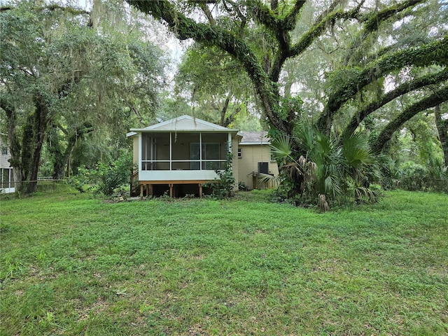 view of yard featuring a sunroom