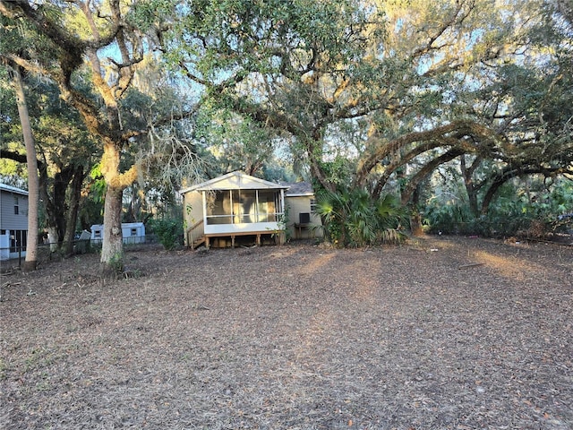 view of front of house with a sunroom