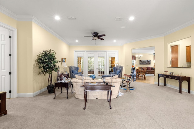 carpeted living room with crown molding and ceiling fan with notable chandelier