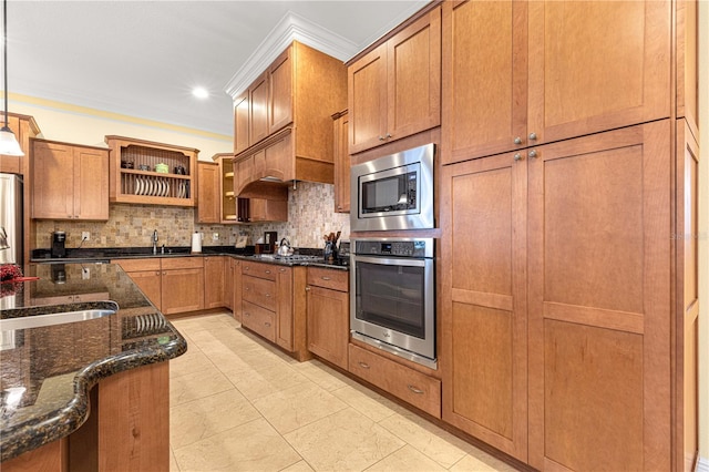 kitchen with appliances with stainless steel finishes, backsplash, dark stone counters, ornamental molding, and decorative light fixtures