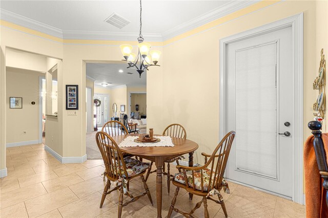 tiled dining space featuring ornamental molding and a chandelier