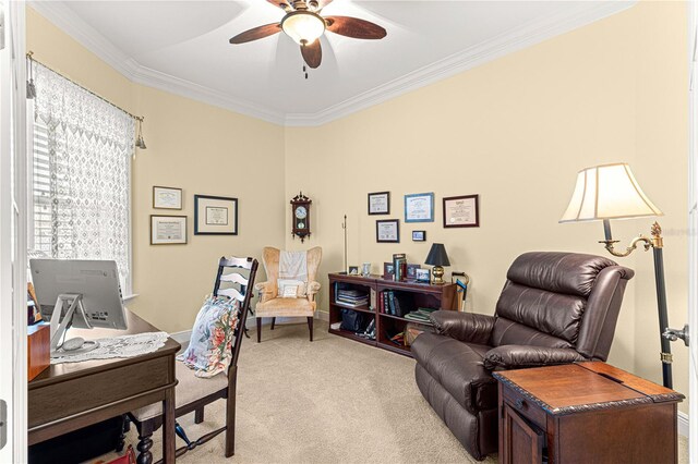 home office featuring light colored carpet, ceiling fan, and crown molding