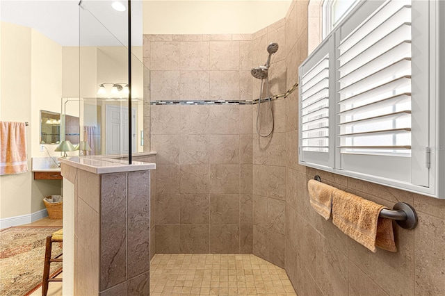 bathroom featuring a tile shower