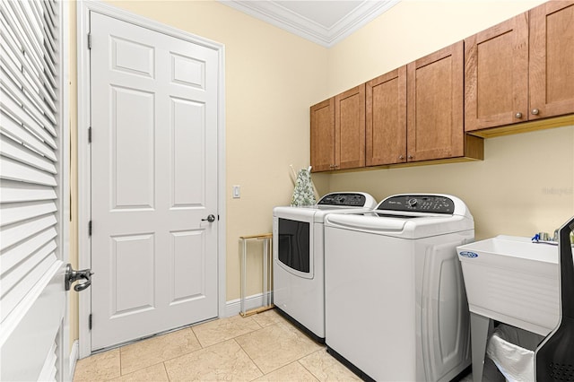 clothes washing area with cabinets, ornamental molding, sink, light tile patterned floors, and independent washer and dryer