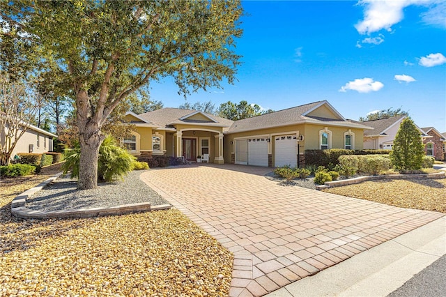 single story home featuring a garage