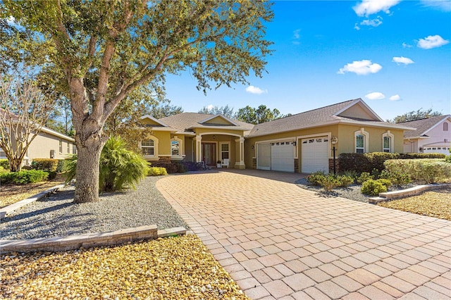 ranch-style house featuring a garage