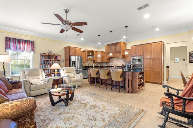 living room featuring ceiling fan and crown molding