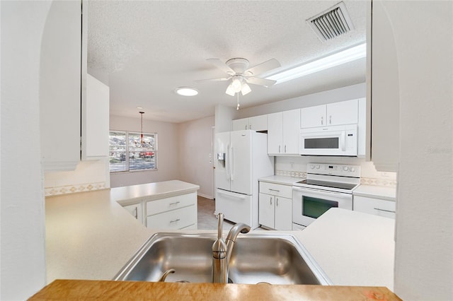 kitchen featuring sink, a textured ceiling, decorative light fixtures, white appliances, and white cabinets