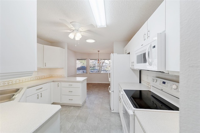 kitchen with kitchen peninsula, tasteful backsplash, white appliances, white cabinetry, and hanging light fixtures