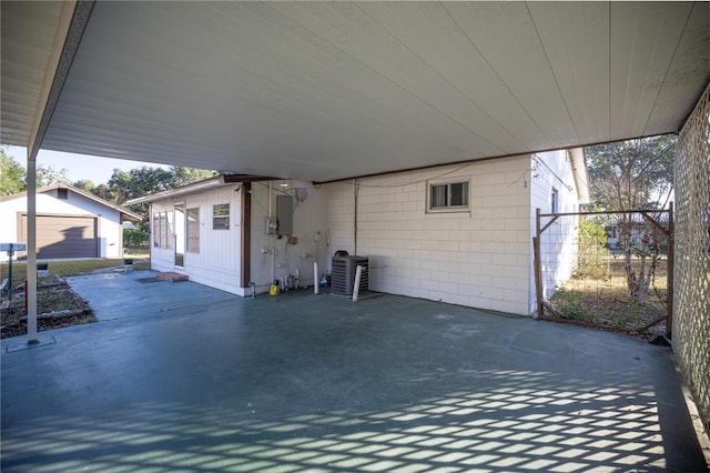 view of patio with electric panel and central AC unit