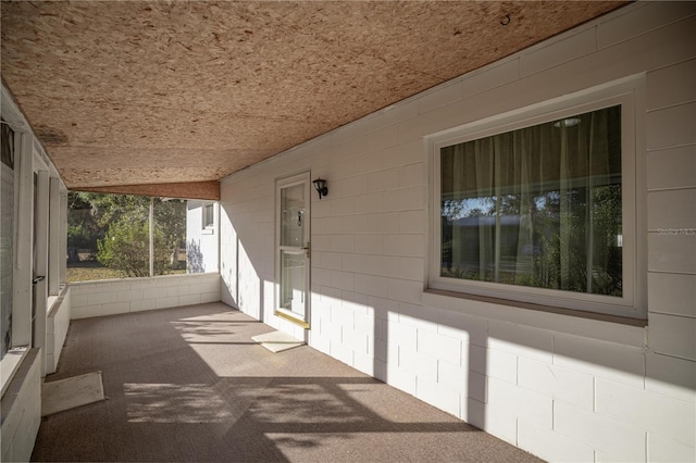 exterior space with wooden ceiling and vaulted ceiling