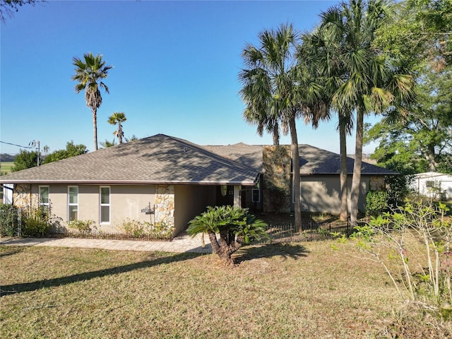 view of side of home featuring a yard