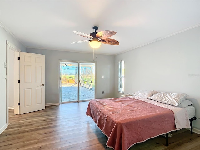 bedroom featuring access to outside, ceiling fan, wood-type flooring, and ornamental molding