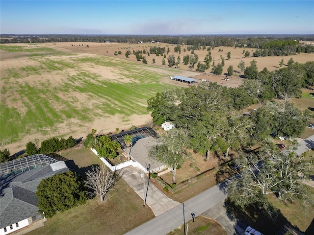 birds eye view of property with a rural view