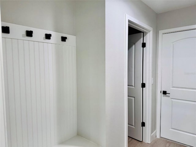 mudroom with light hardwood / wood-style flooring