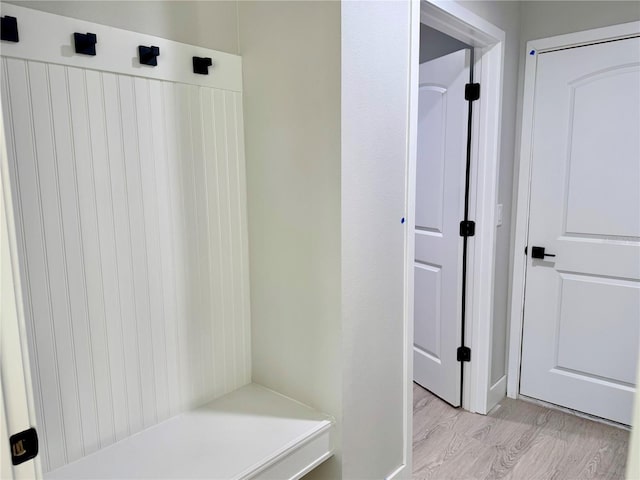 mudroom with light hardwood / wood-style floors