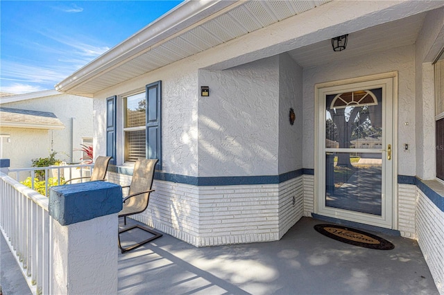 doorway to property with covered porch