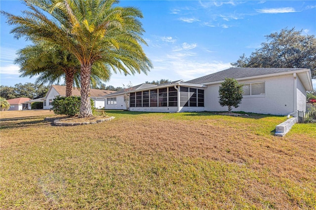 view of yard with a sunroom