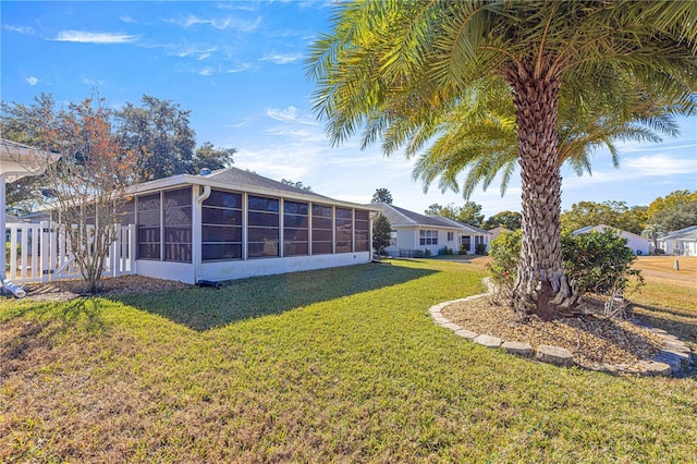 view of yard with a sunroom