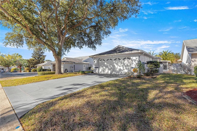 view of front facade featuring a front yard and a garage