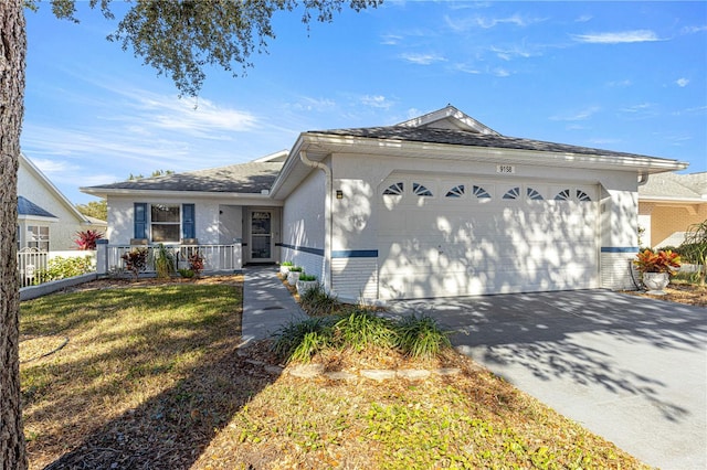 9158 SW 91st Ter, Ocala, FL 34481 - ranch-style house with a garage, stucco siding, driveway, and brick siding