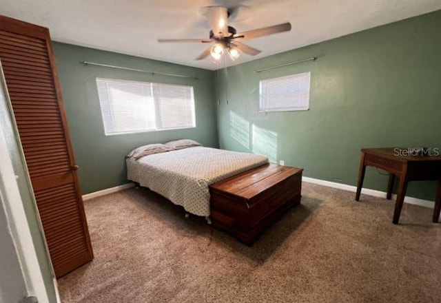 carpeted bedroom featuring ceiling fan