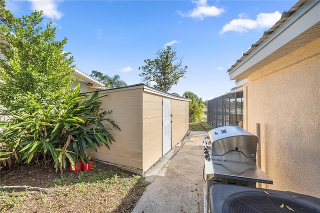 view of property exterior with a sunroom