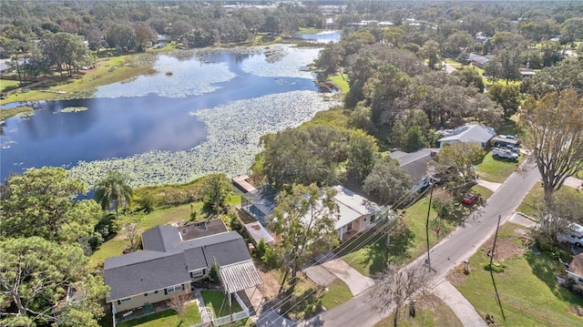 birds eye view of property with a water view