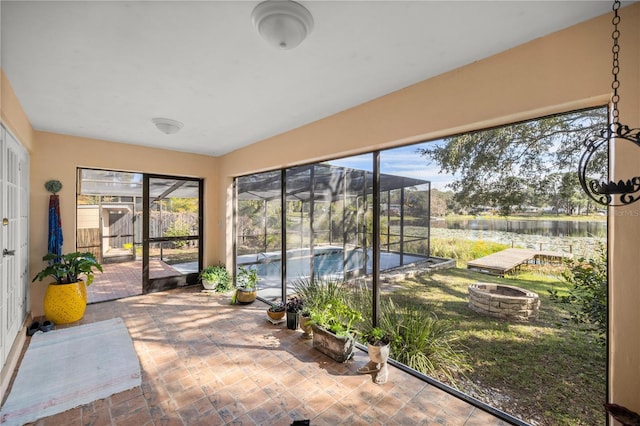 sunroom with a water view