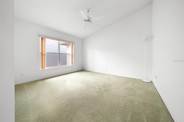 unfurnished room with baseboards, carpet flooring, a textured ceiling, and lofted ceiling