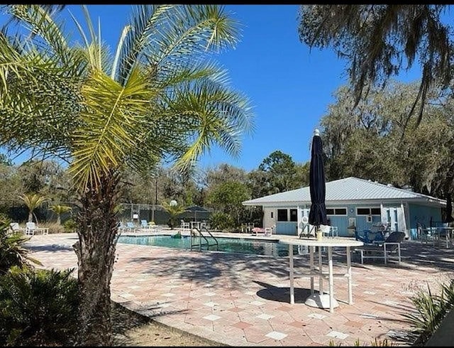 view of pool featuring a patio area