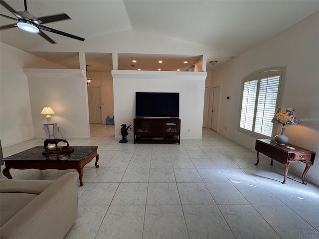 living room featuring lofted ceiling, ceiling fan, and light tile patterned floors