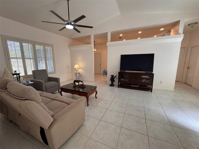 living room featuring ceiling fan, light tile patterned floors, and lofted ceiling