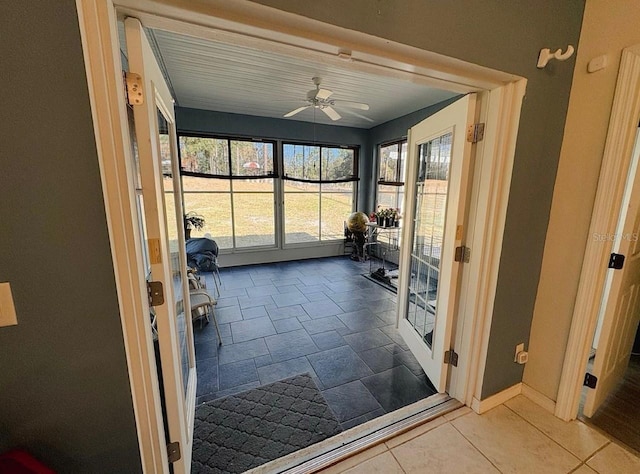 workout area with ceiling fan