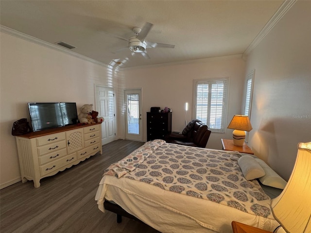 bedroom with ceiling fan, ornamental molding, and dark hardwood / wood-style floors