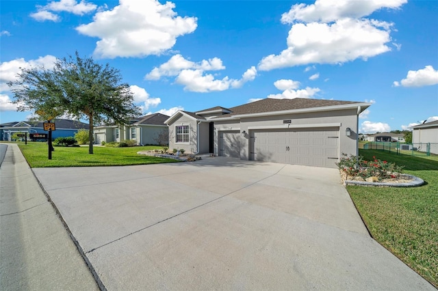 ranch-style house with a garage and a front yard