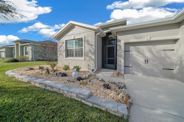 view of front of home with a front yard and a garage