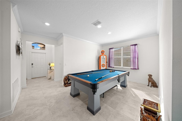 recreation room with a textured ceiling, ornamental molding, and billiards