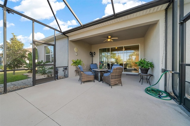 sunroom / solarium featuring ceiling fan