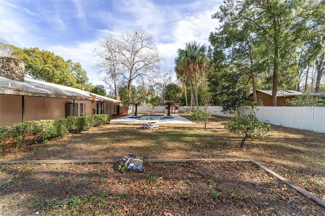 view of yard featuring a fenced in pool