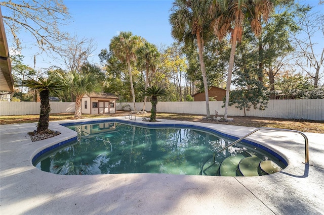 view of pool with a patio area and an outdoor structure