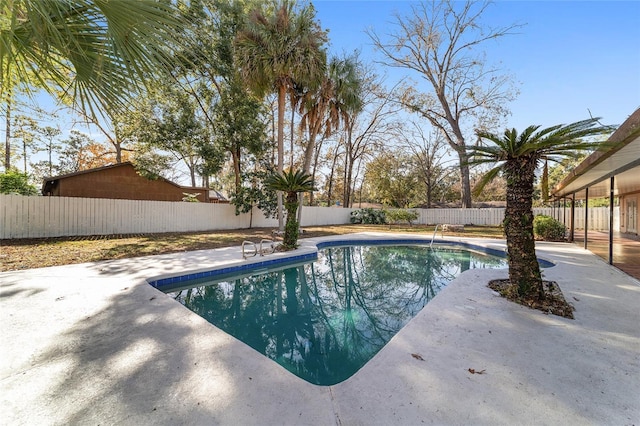 view of swimming pool with a patio