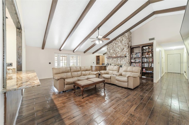 living room with ceiling fan, beamed ceiling, and high vaulted ceiling