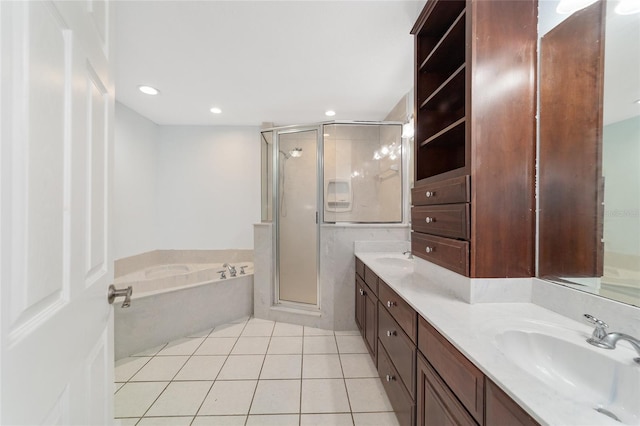 bathroom with tile patterned floors, vanity, and plus walk in shower