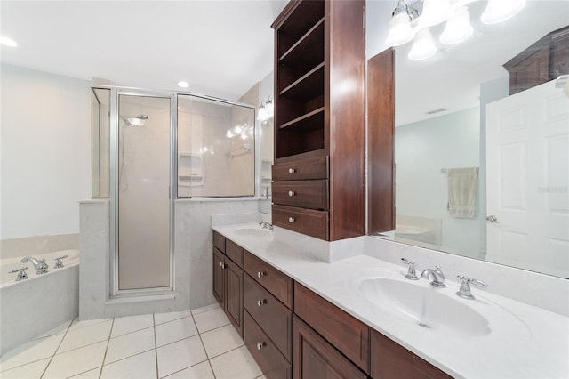 bathroom with shower with separate bathtub, vanity, and tile patterned floors