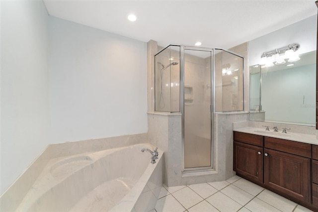 bathroom with tile patterned flooring, vanity, and plus walk in shower