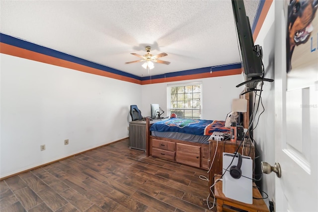 bedroom featuring a textured ceiling, ceiling fan, and dark wood-type flooring